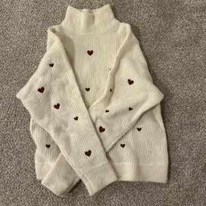 Elegant Cream Turtleneck Sweater with Heart Accents